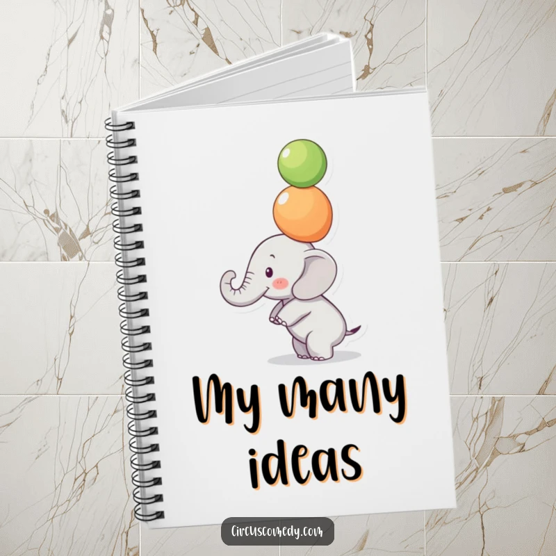 Funny Focused Elephant Notebook: A small elephant balances colorful balls on its trunk with intense focus, ideal for funny notes.