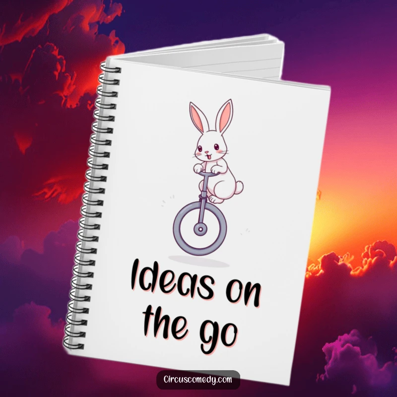 Funny rabbit notebook with a cover featuring a determined rabbit with perked ears, balancing on a large unicycle, inspiring creative writing.
